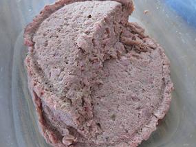 Frozen chicken raw dog food patty from Stella & Chewy's